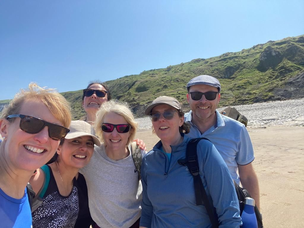 CF Staff posing for a picture on a beach